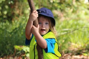 Early learner student swringing on vine at Bush Kindy Suncoast Little Leaners