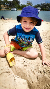 Beach Kindy - Suncoast Little Learner digging in sand at Beach