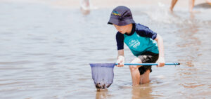 Beach Kindy - Suncoast Little Learner with finshing net at Sunshine Coast beach