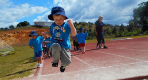 Pre-school kindergarten student at long jump - Suncoast Little Leaners