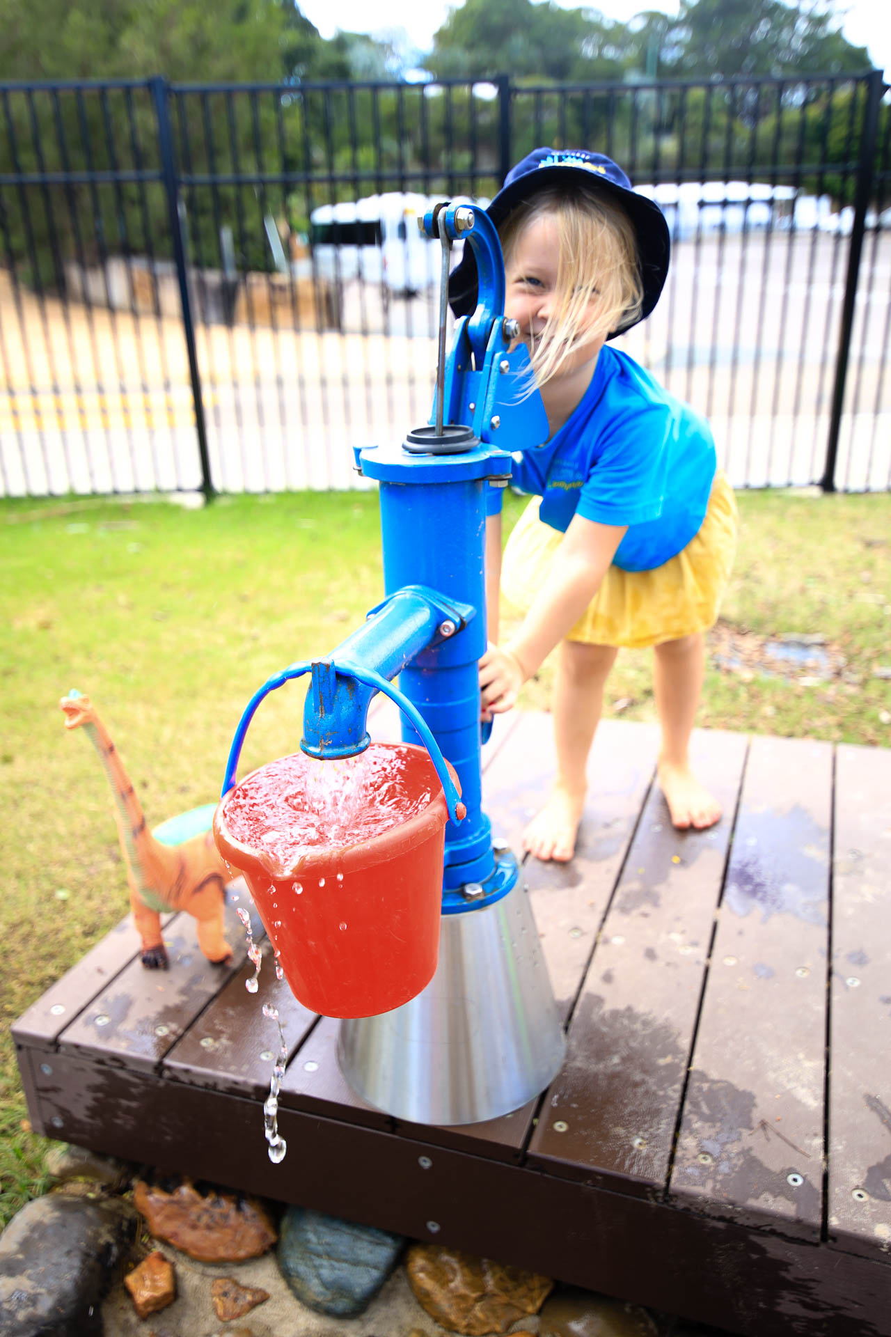 Water Pump and bucket Preschool student - Sunshine Coast Kindergarten