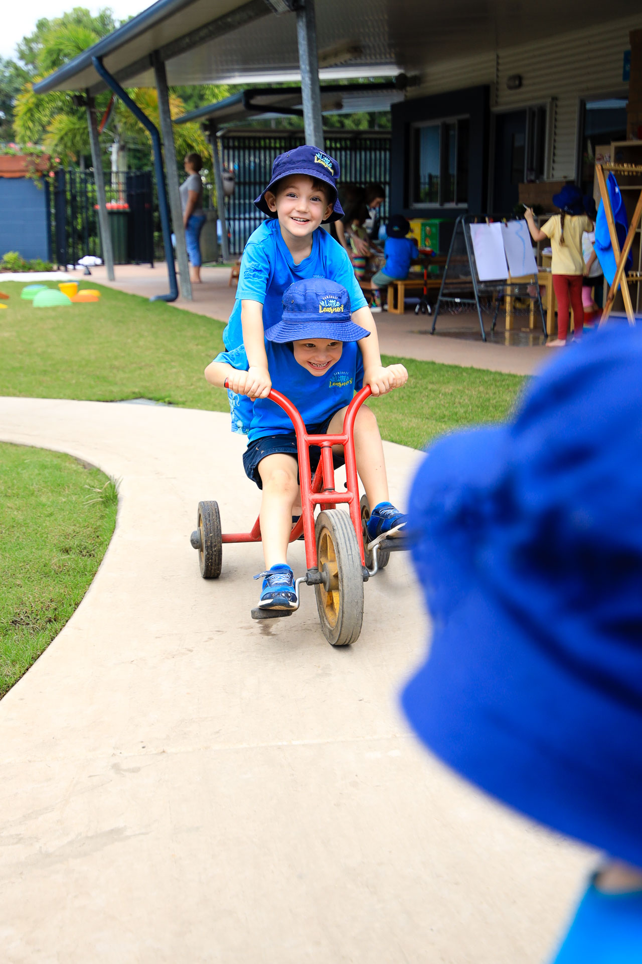 Tricycle riding Preschool student - Sunshine Coast Kindergarten