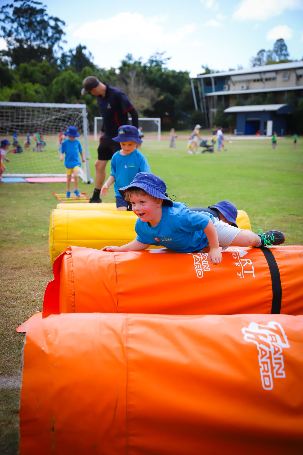 Sunshine Coast Pre Schooler climbing obstacles at Sports Carnival